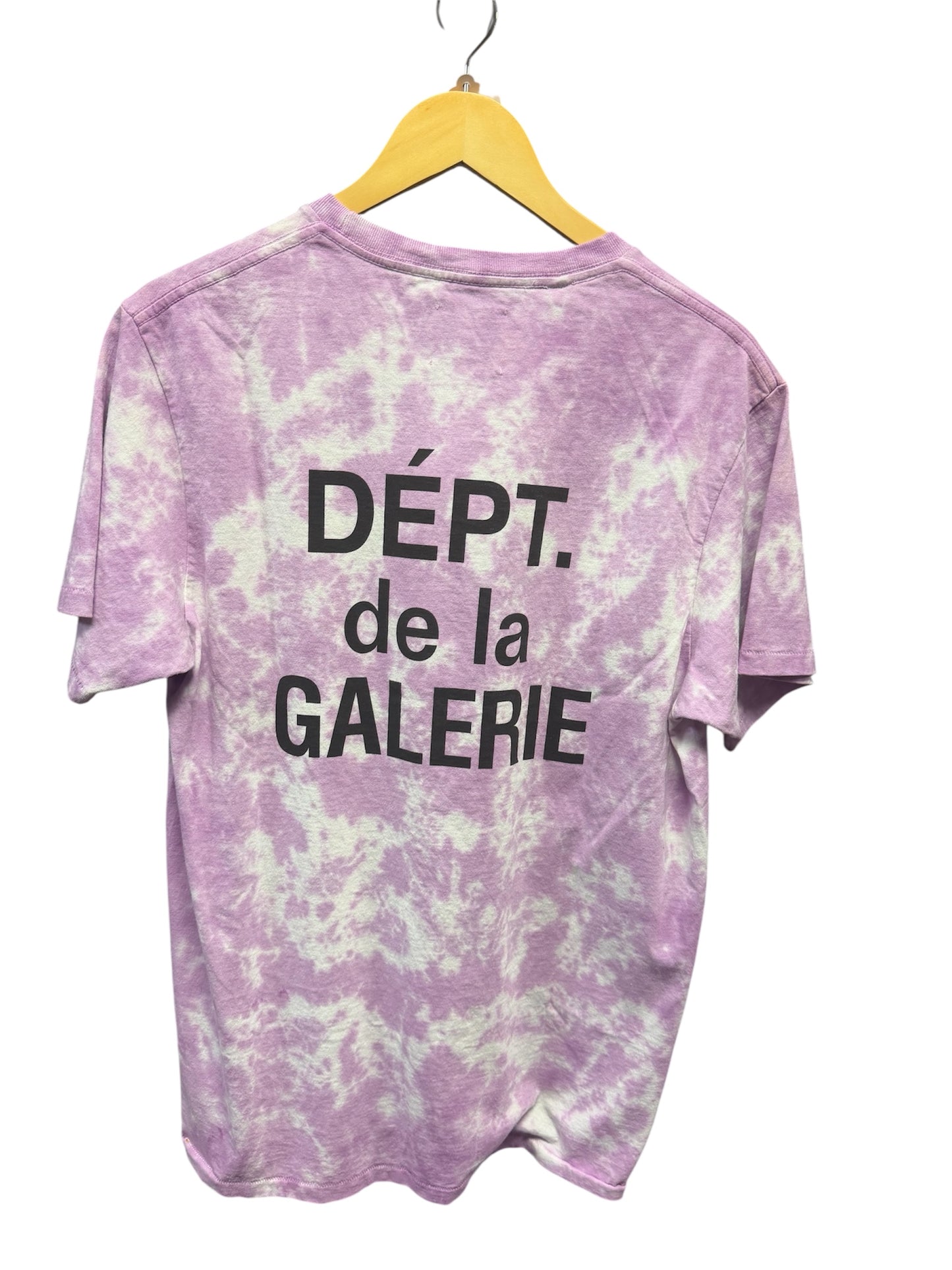 Gallery Dept medium tie-dye shirt featuring vibrant colors and a relaxed fit, styled with casual accessories.