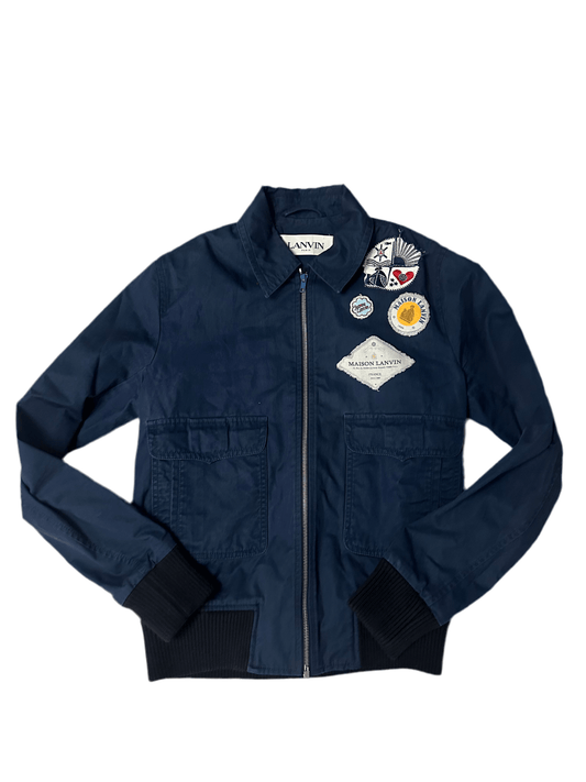 Lanvin Blue Bomber Jacket Pre owned Small with embroidered patches on chest, front zip closure, and ribbed cuffs. Stylish outerwear for men.